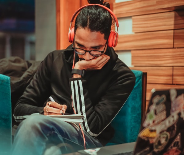 Man listening music - Photo by Dollar Gill